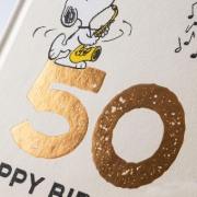 Buchcover und Innenansicht für das Buch: Peanuts Geschenkbuch: Happy Birthday zum 50. Geburtstag