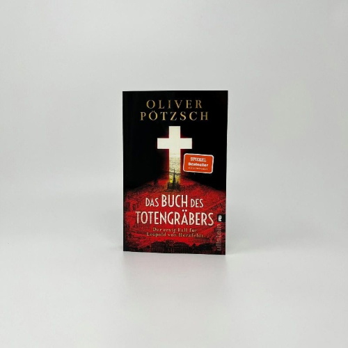 Buchcover und Innenansicht für das Buch: Das Buch des Totengräbers